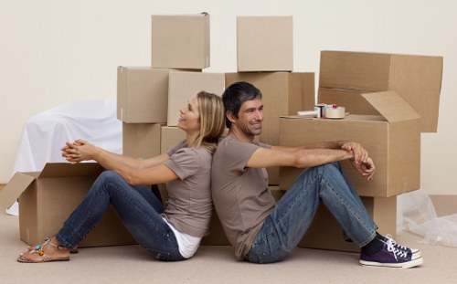 Local removals team loading boxes and furniture carefully