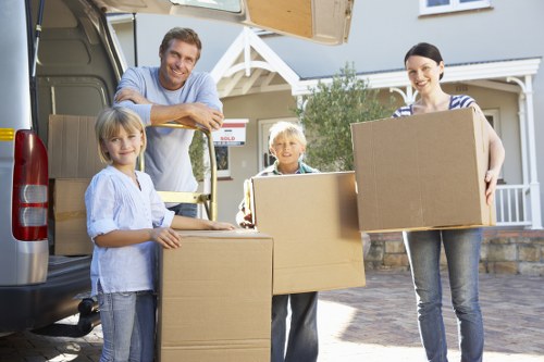 Packed boxes and furniture prepared for man and van removal